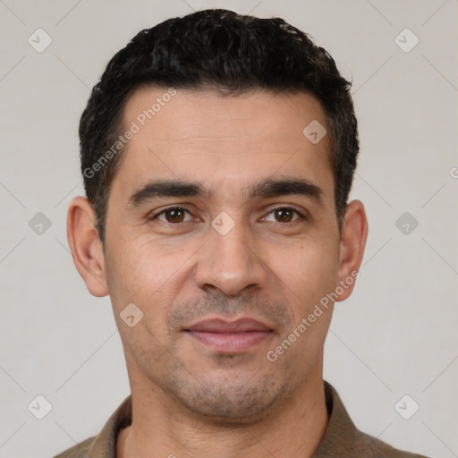 Joyful white young-adult male with short  black hair and brown eyes