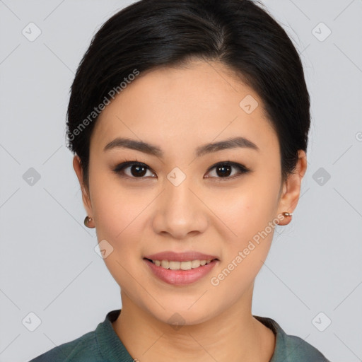 Joyful asian young-adult female with medium  black hair and brown eyes