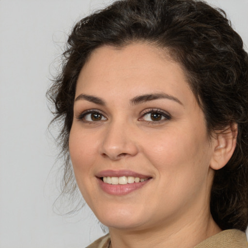 Joyful white young-adult female with medium  brown hair and brown eyes