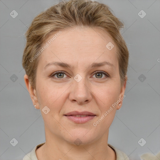 Joyful white adult female with short  brown hair and grey eyes