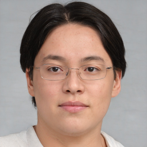 Neutral asian adult male with short  brown hair and brown eyes