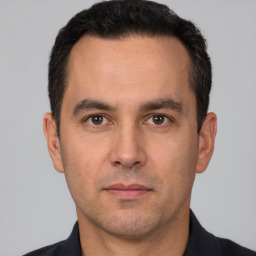 Neutral white adult male with short  brown hair and brown eyes