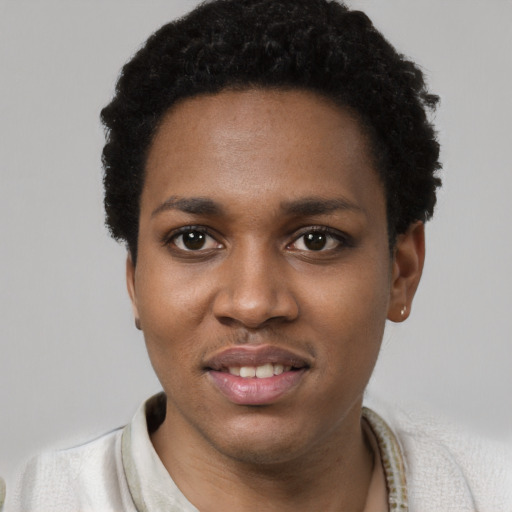 Joyful black young-adult female with short  black hair and brown eyes
