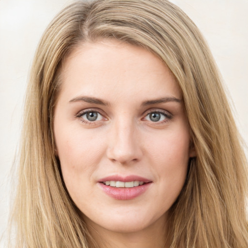 Joyful white young-adult female with long  brown hair and green eyes