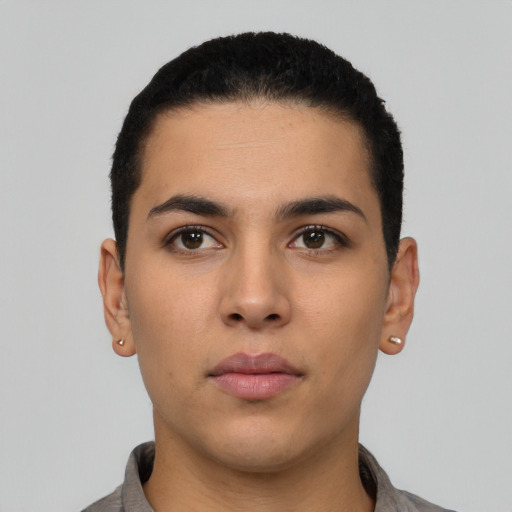 Neutral latino young-adult male with short  black hair and brown eyes