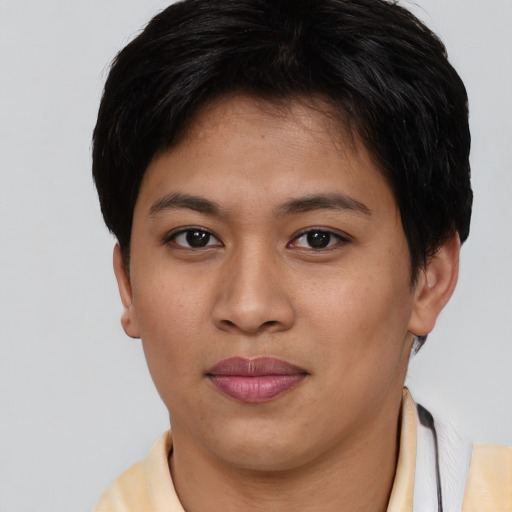 Joyful asian young-adult female with short  brown hair and brown eyes