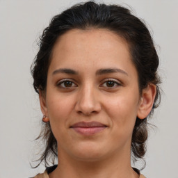 Joyful white young-adult female with medium  brown hair and brown eyes