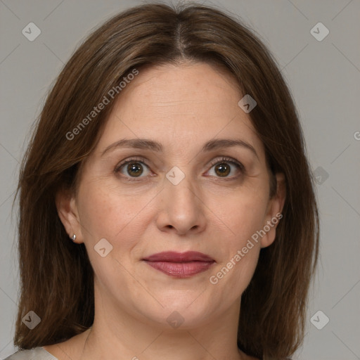 Joyful white adult female with medium  brown hair and grey eyes