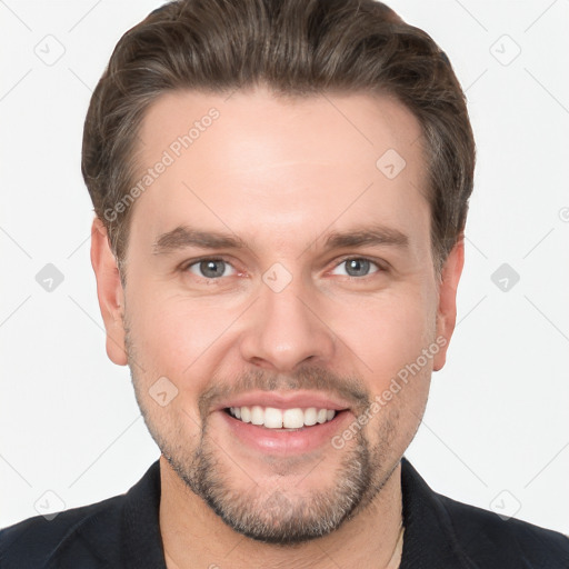 Joyful white young-adult male with short  brown hair and grey eyes