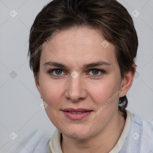 Joyful white young-adult female with short  brown hair and grey eyes