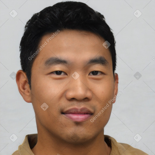 Joyful asian young-adult male with short  black hair and brown eyes