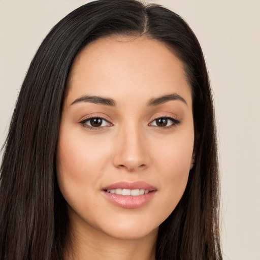 Joyful white young-adult female with long  brown hair and brown eyes