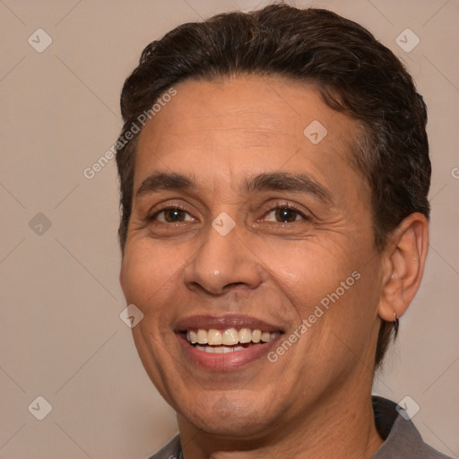 Joyful white adult male with short  brown hair and brown eyes