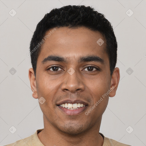 Joyful latino young-adult male with short  black hair and brown eyes