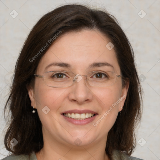 Joyful white adult female with medium  brown hair and grey eyes