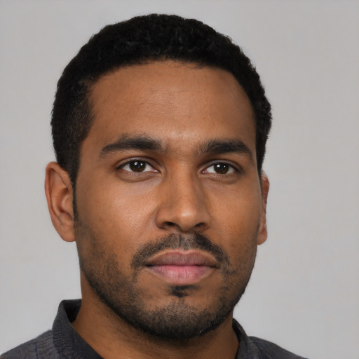 Neutral black young-adult male with short  black hair and brown eyes