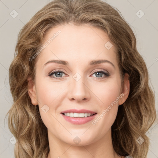 Joyful white young-adult female with long  brown hair and green eyes