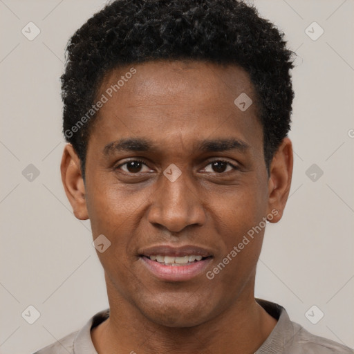 Joyful black young-adult male with short  black hair and brown eyes