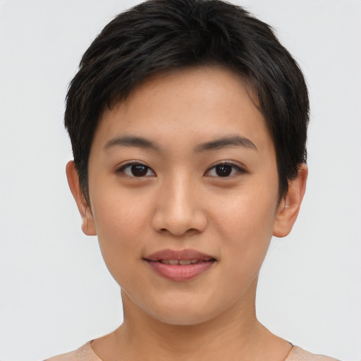 Joyful asian young-adult female with short  brown hair and brown eyes