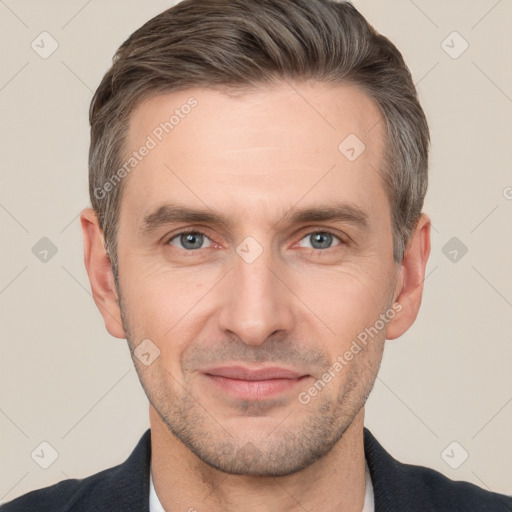 Joyful white adult male with short  brown hair and brown eyes