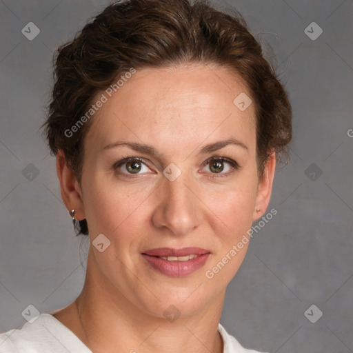 Joyful white adult female with short  brown hair and grey eyes