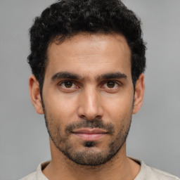 Neutral white young-adult male with short  black hair and brown eyes