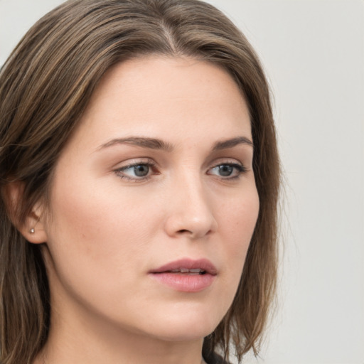 Neutral white young-adult female with long  brown hair and grey eyes