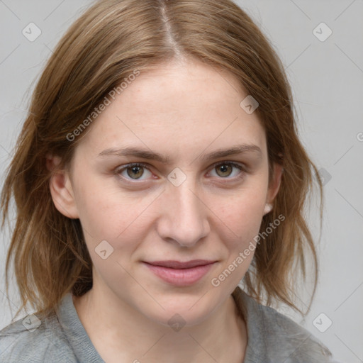 Joyful white young-adult female with medium  brown hair and blue eyes