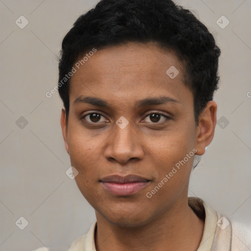 Joyful black young-adult male with short  brown hair and brown eyes