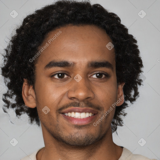 Joyful black young-adult male with short  brown hair and brown eyes