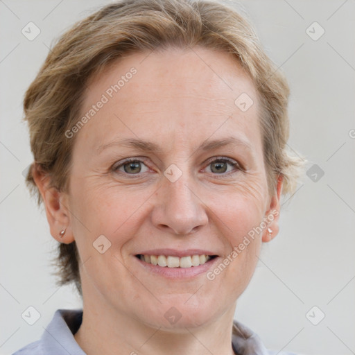 Joyful white adult female with medium  brown hair and grey eyes