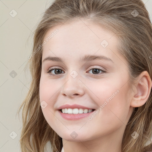 Joyful white child female with long  brown hair and grey eyes