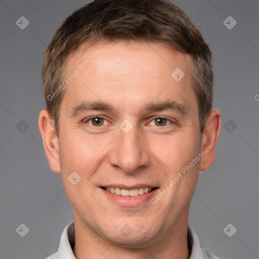 Joyful white adult male with short  brown hair and brown eyes