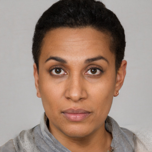 Neutral latino young-adult female with short  brown hair and brown eyes