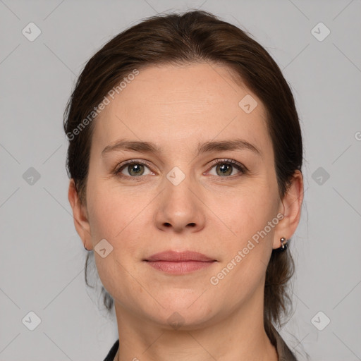 Joyful white adult female with medium  brown hair and grey eyes