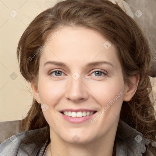 Joyful white young-adult female with medium  brown hair and green eyes