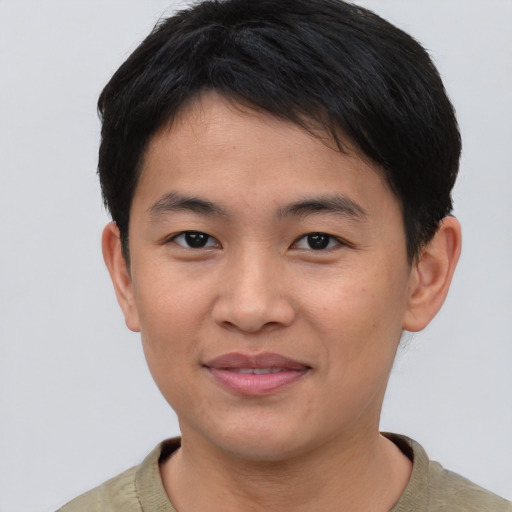 Joyful asian young-adult male with short  brown hair and brown eyes