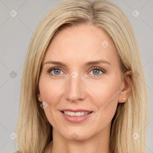 Joyful white adult female with long  brown hair and grey eyes