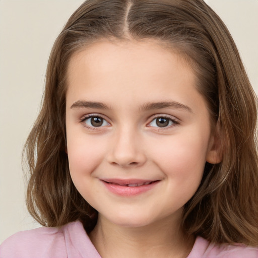 Joyful white child female with long  brown hair and brown eyes