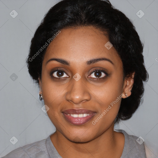 Joyful black young-adult female with short  black hair and brown eyes