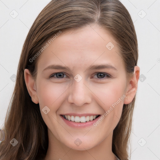 Joyful white young-adult female with long  brown hair and grey eyes