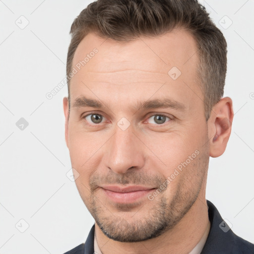 Joyful white adult male with short  brown hair and brown eyes