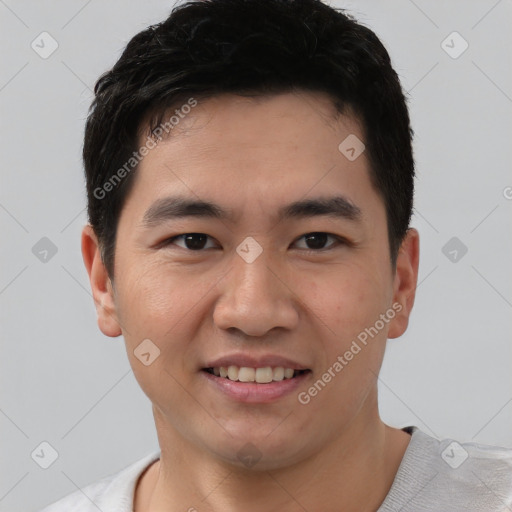 Joyful white young-adult male with short  black hair and brown eyes