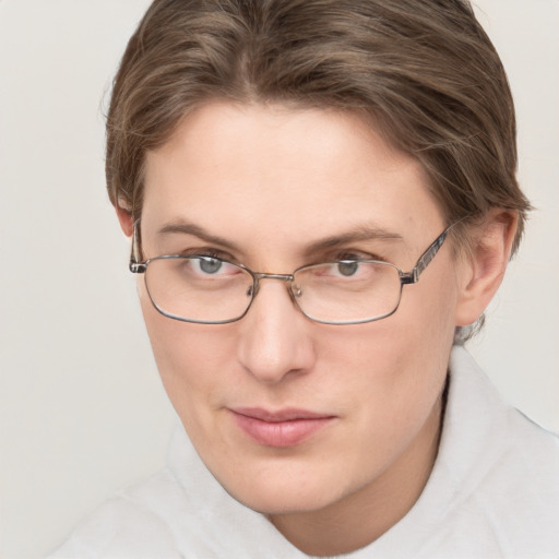 Joyful white young-adult female with short  brown hair and blue eyes