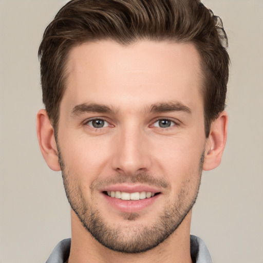 Joyful white young-adult male with short  brown hair and brown eyes