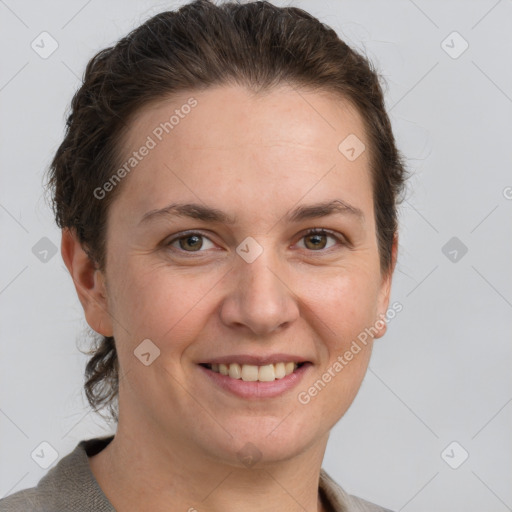 Joyful white adult female with short  brown hair and grey eyes