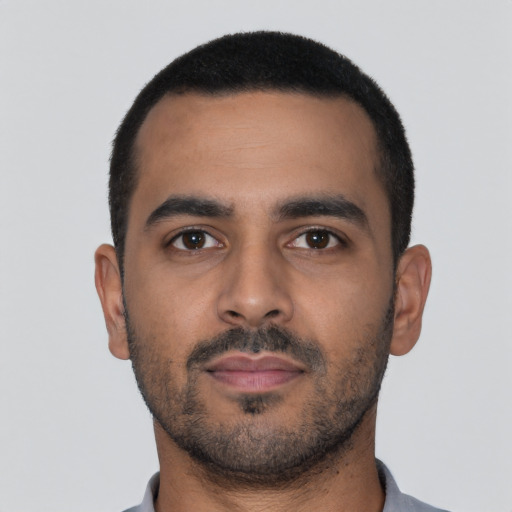 Neutral latino young-adult male with short  brown hair and brown eyes