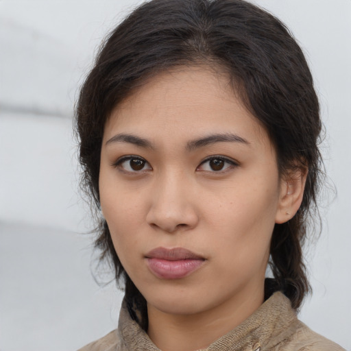 Neutral asian young-adult female with medium  brown hair and brown eyes