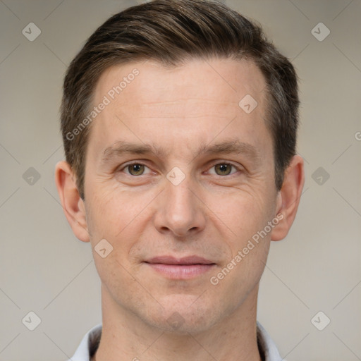 Joyful white adult male with short  brown hair and grey eyes