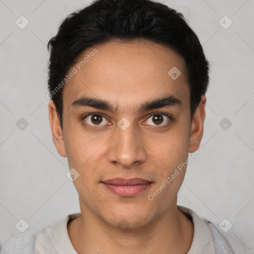 Joyful latino young-adult male with short  black hair and brown eyes